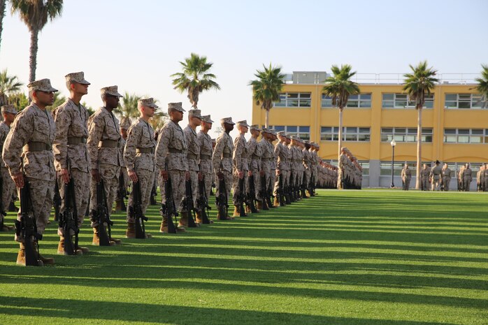 Recruits of Company H, 2nd Recruit Training Battalion, await their senior drill instructor inspection where they’ll be inspected on their uniform, knowledge, rifle cleanliness and rifle manual aboard the depot, Oct. 4. As drill instructors create chaos, the recruits, have to maintain their bearing, one of the Marine Corps leadership traits.