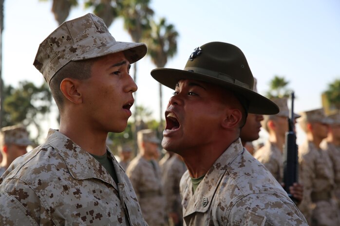 A drill instructor of Company H, 2nd Recruit Training Battalion stands in front of a recruit and tests his bearing while inspecting him on his knowledge, uniform, rifle cleanliness and rifle manual. Marines can find themselves in a combat situation full of chaos and must hold their composure while completing the mission.