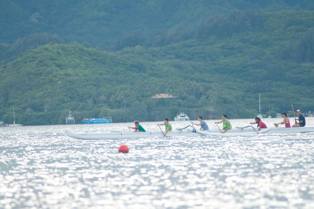 Youth paddlers of Na Koa Lani Outrigger Canoe Club glide around Kaneohe Bay, Oct. 14, 2013. Members can participate in recreational paddling or join the club racing team. (U.S. Marine Corps photo by Christine Cabalo)