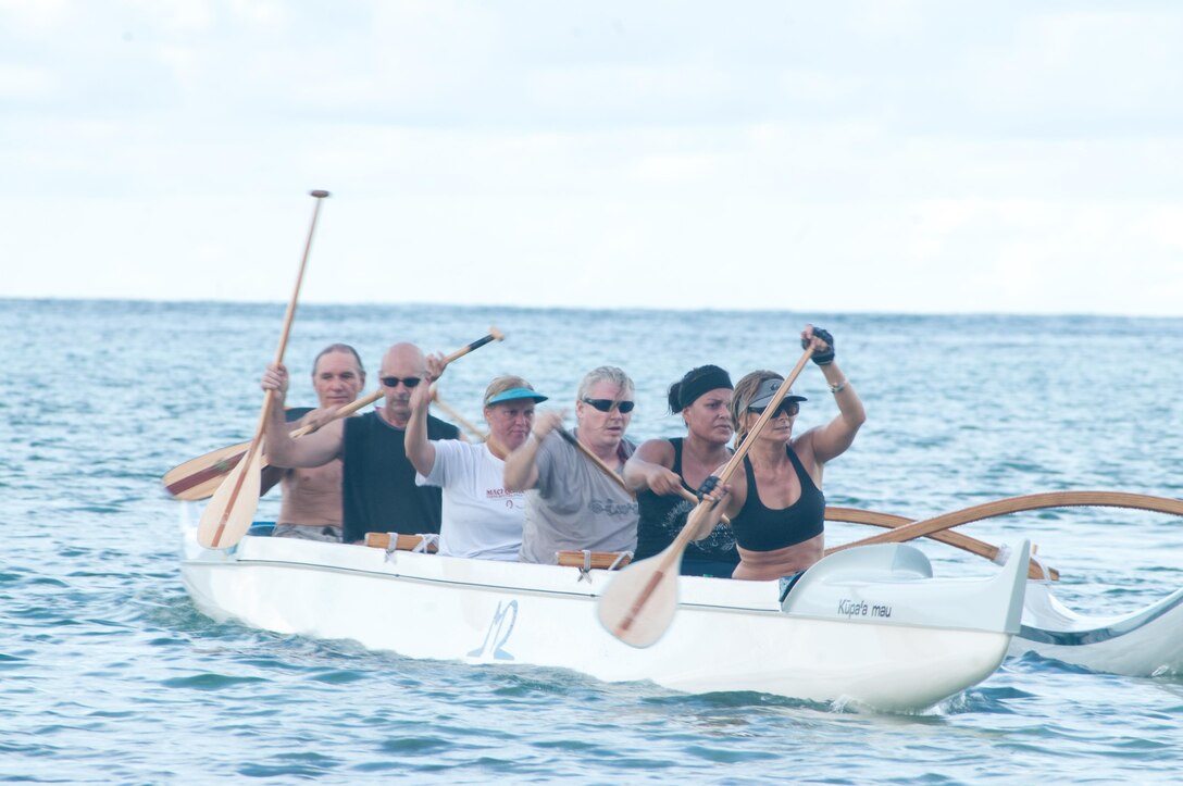 Paddlers navigate toward Hale Koa Beach after traveling around Kaneohe Bay. This year the club has participated in 20 races, including "Na Pali Challenge" which requires male and female paddlers to travel more than 39 miles around the coast of Kauai. (U.S. Marine Corps photo by Christine Cabalo)