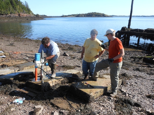 ERDC researchers core concrete slabs that have been exposed to the environment at ERDC’s Treat Island Natural Weather Station during recent field work.