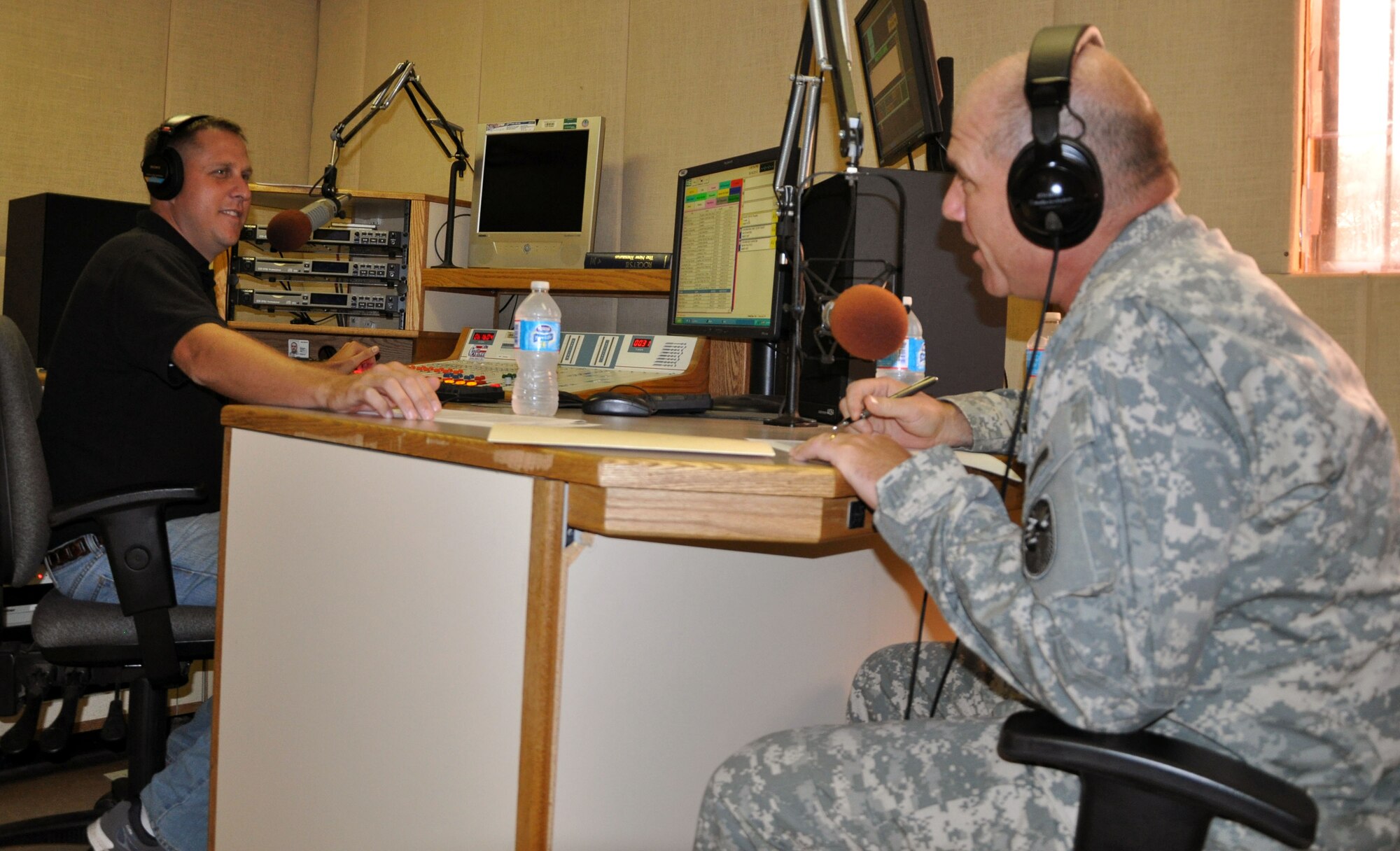 U.S. Army Col. Thomas Boccardi, Joint Task Force-Bravo commander, paid a visit to the American Forces Network-Honduras radio studio, Oct. 16, 2013. Col. Boccardi was hosted live on the air by U.S. Army Staff Sgt. Michael Sparks. The commander discussed several current issues affecting members of Joint Task Force-Bravo. (U.S. Air Force photos by Capt. Zach Anderson) 