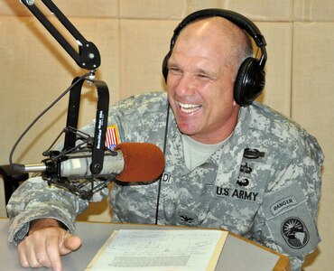 U.S. Army Col. Thomas Boccardi, Joint Task Force-Bravo commander, paid a visit to the American Forces Network-Honduras radio studio, Oct. 16, 2013. Col. Boccardi was hosted live on the air by U.S. Army Staff Sgt. Michael Sparks. The commander discussed several current issues affecting members of Joint Task Force-Bravo. (U.S. Air Force photos by Capt. Zach Anderson) 