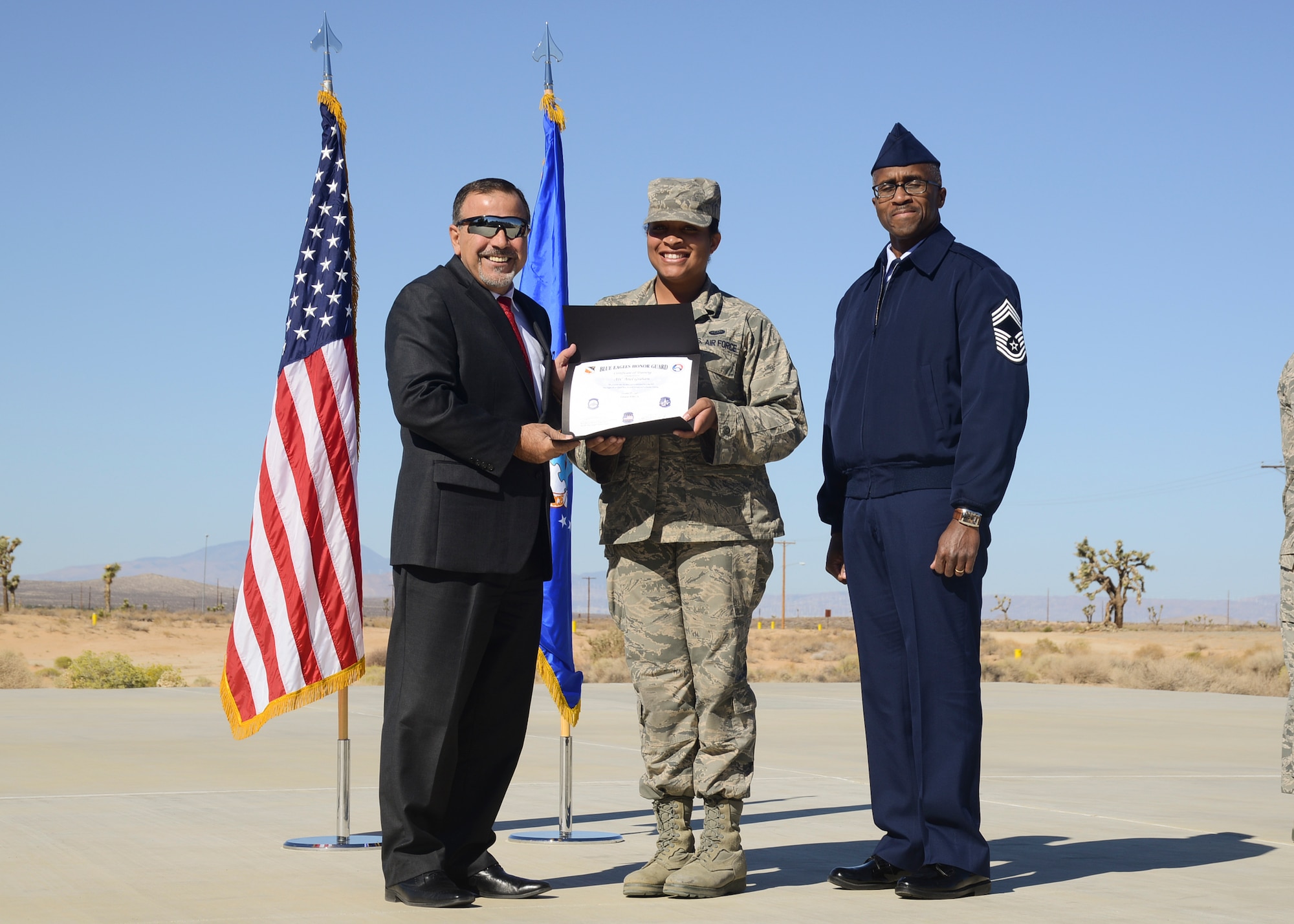 Alexander Kovras, 412th Force Support Squadron director (left) presented certificates to each of the graduates. (U.S. Air Force photo by Rebecca Amber). 