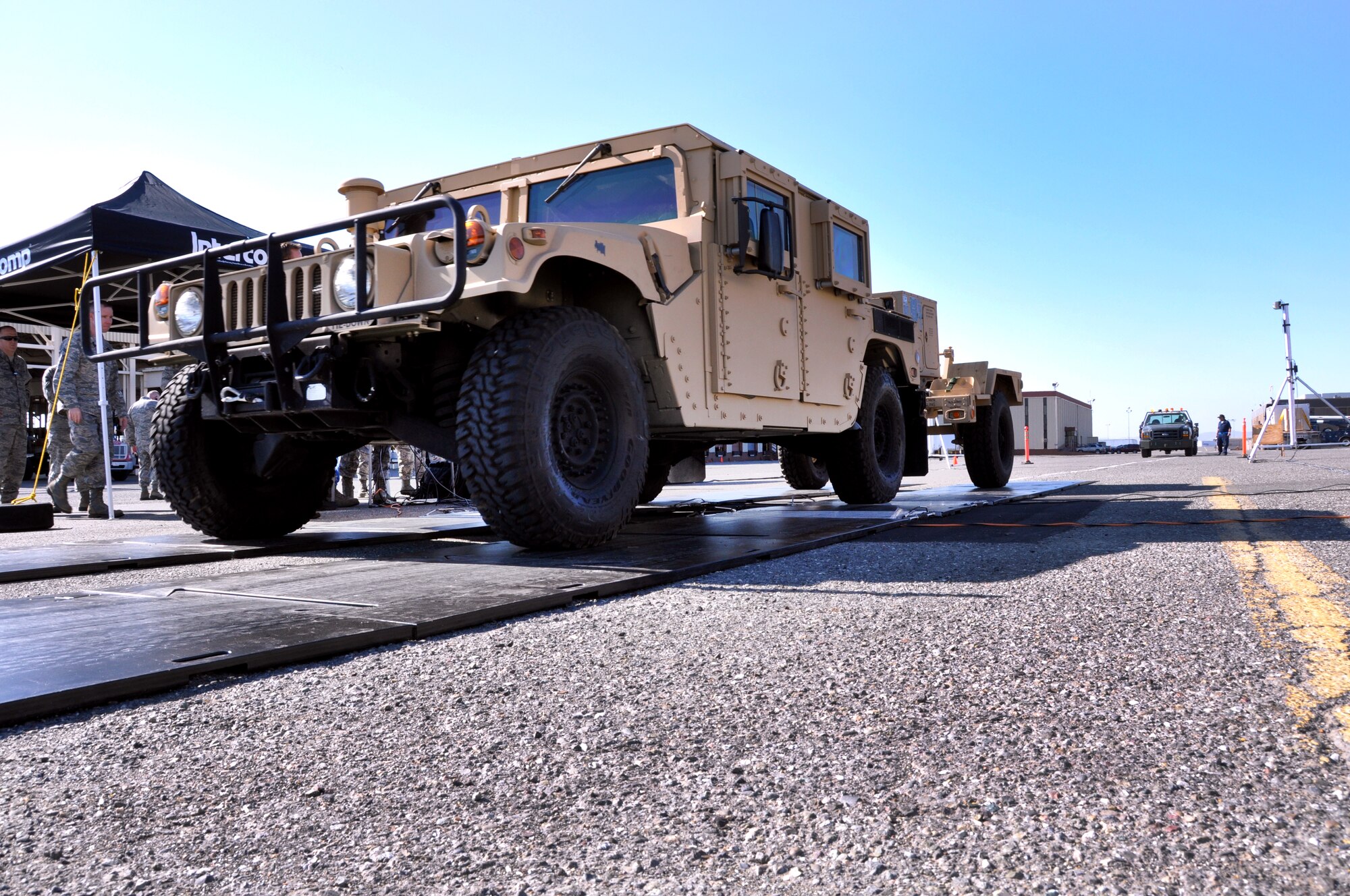 Tech. Sgt. Tara Welch, 60th APS special handling, drives a Humvee over the scale portion of the new DACMS. (U.S. Air Force photo/Staff Sgt. Patrick Harrower)