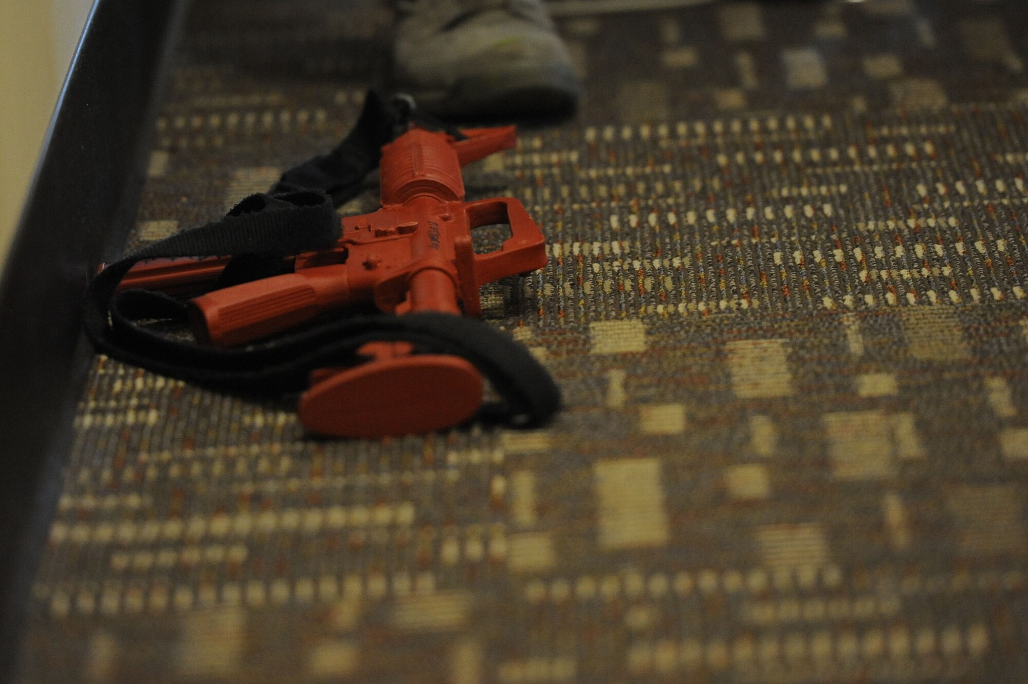 A weapon is secured from the active shooter in an exercise Oct 17, 2013, Keesler Air Force Base, Miss. The active shooter exercise was the first of its kind to prepare the 85th EIS compound for the 81st Security Forces Squadron’s response time during a real world incident. (U.S. Air Force photo by Airman 1st Class Stephan Coleman)