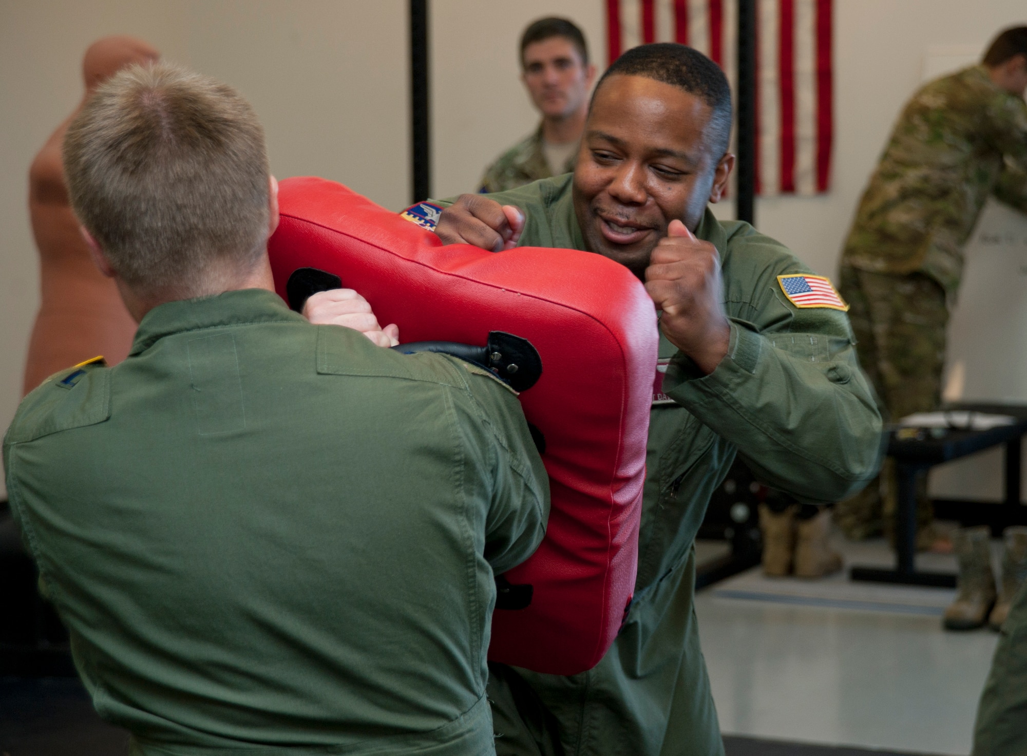 Tech. Sgt. Davie Hobbs, 384th Air Refueling Squadron boom operator, practices a U.S. Army combatives move during a combat survival training course Oct. 8, 2013, at McConnell Air Force Base, Kan. Hobbs and several other aircrew members participated in the course as part of their survival, evasion, rescue and escape refresher training. (U.S. Air Force photo/Airman 1st Class Victor J. Caputo)