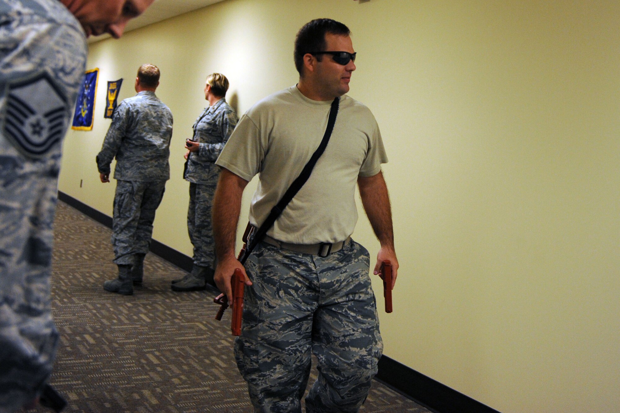 Staff Sgt. Bryant Horton, 85th Engineering Installation Squadron, plays the part of the active shooter, going room to room for targets, during an exercise Oct 17, 2013, Keesler Air Force Base, Miss. The active shooter exercise was the first of its kind to prepare the 85th EIS compound for the 81st Security Forces Squadron’s response time during a real world incident. (U.S. Air Force photo by Airman 1st Class Stephan Coleman)