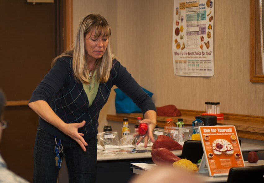 Geri Seal, 28th Medical Operations Squadron health promotion program manager, explains to attendees of the Better Body Better Life class that the heart is also a muscle that needs to be exercised in the Health and Wellness Center at Ellsworth Air Force Base, S.D., Oct. 10, 2013. The HAWC offers a variety of nutrition and dietary classes to help Airmen, families and civilians to be proactive about their health. (U.S. Air Force photo by Airman 1st Class Alystria Maurer/Released)