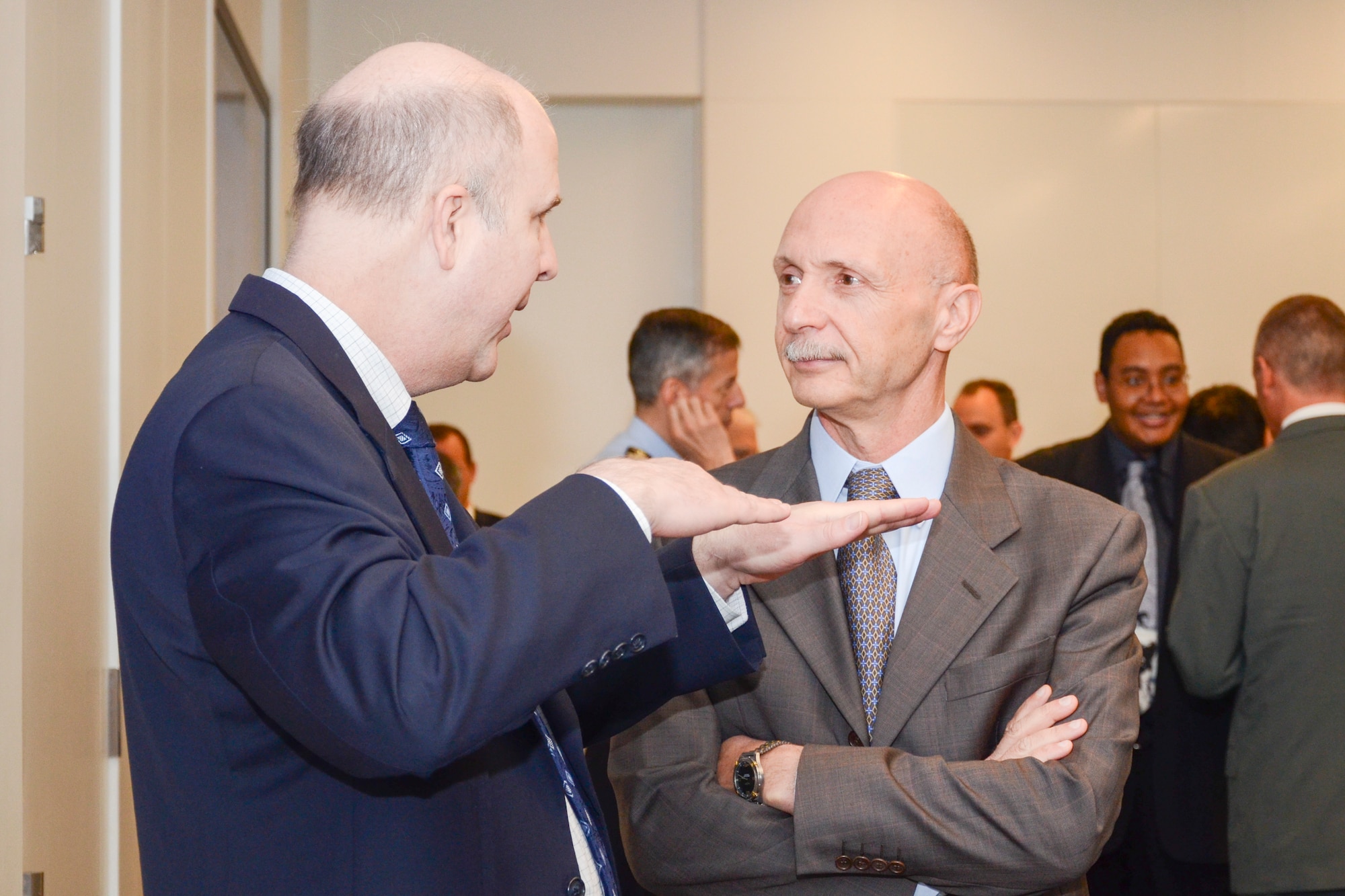 AFOSR Acting Director, Dr. Patrick Carrick conversing at the Air Force Office of Scientific Research (AFOSR) and the Embassy of Italy technical exchange meeting in held in Arlington, Va. 