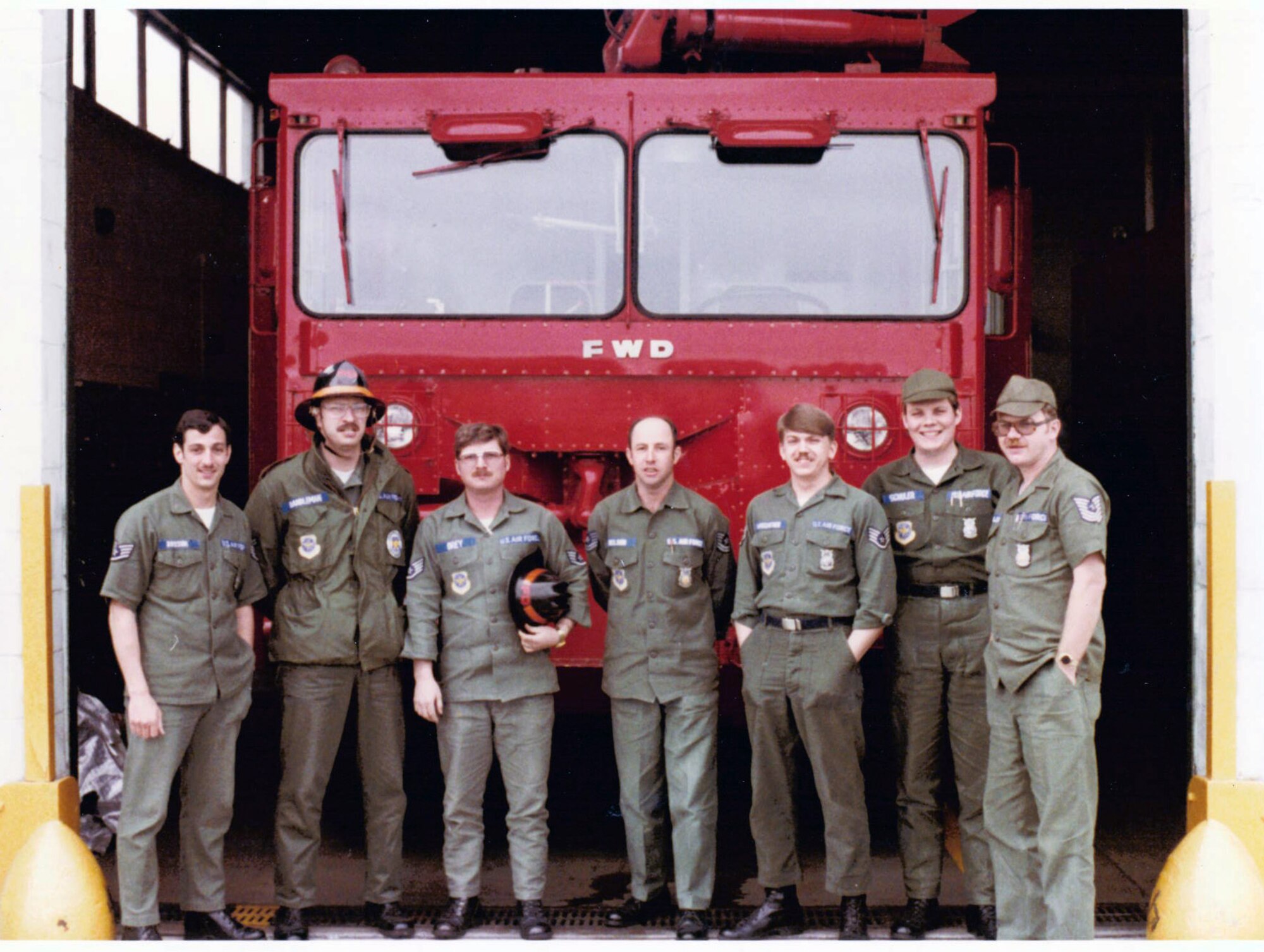 At the end of an annual Deployment for Training in 1982, the firefighters of the 133rd are photographed by the Air Force’s second largest crash truck, a 2000 gallon P-2.  Courtesy of the Minnesota Air National Guard.