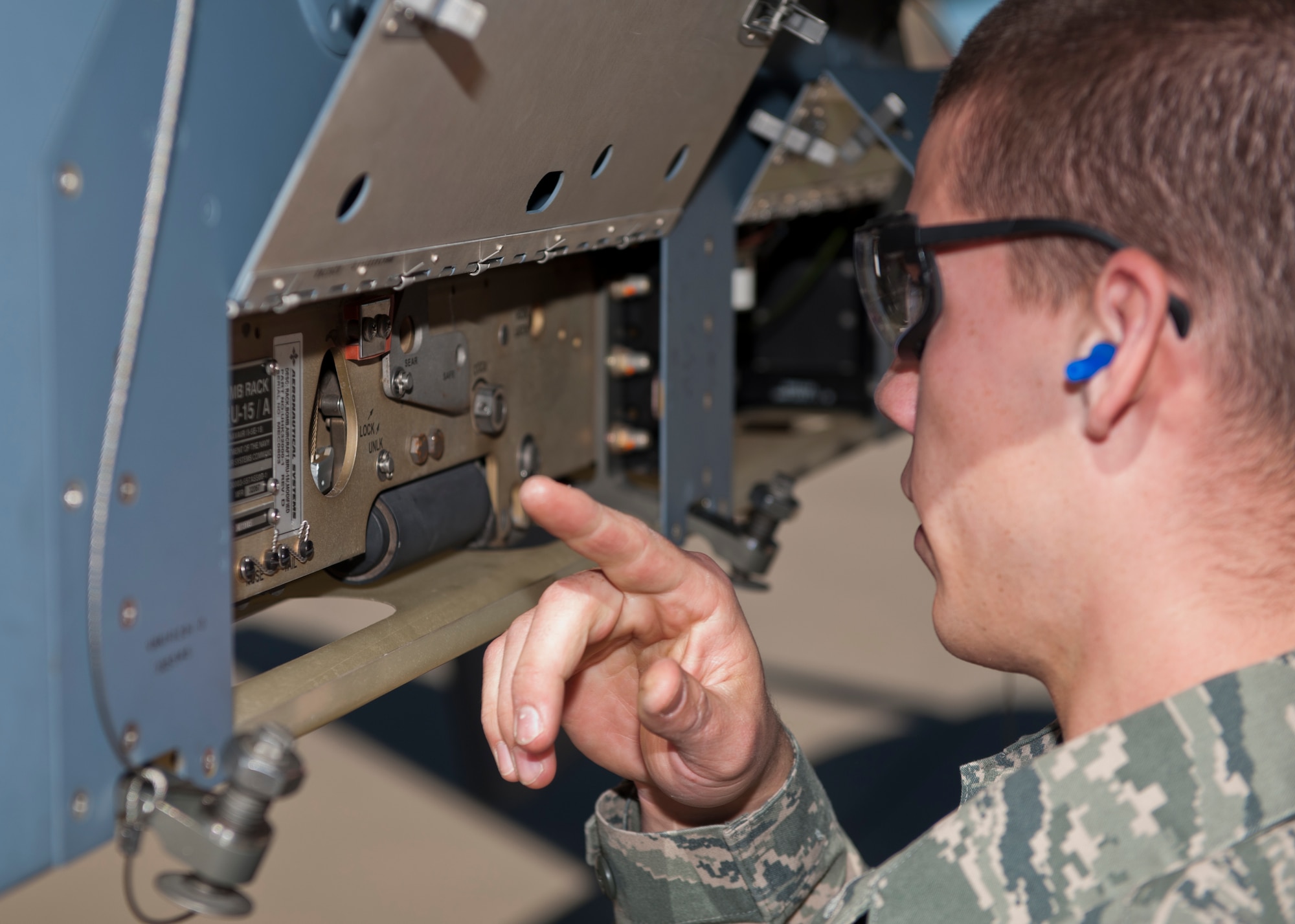 Airman 1st Class Robert Lawrence, 849th Aircraft Maintenance Squadron weapons load crew, prepares an MQ-9 Reaper before loading an inert missile during the quarterly load crew competition at Holloman Air Force Base, N.M., Oct. 11. The MQ-9 Reaper load crew competed to have their skills evaluated alongside the F-22 Raptor and German Air Force Tornado load crews. For the competition, points are awarded during the weapons loading, tool kit inspection and uniform inspection. (U.S. Air Force photo by Airman 1st Class Aaron Montoya/Released)