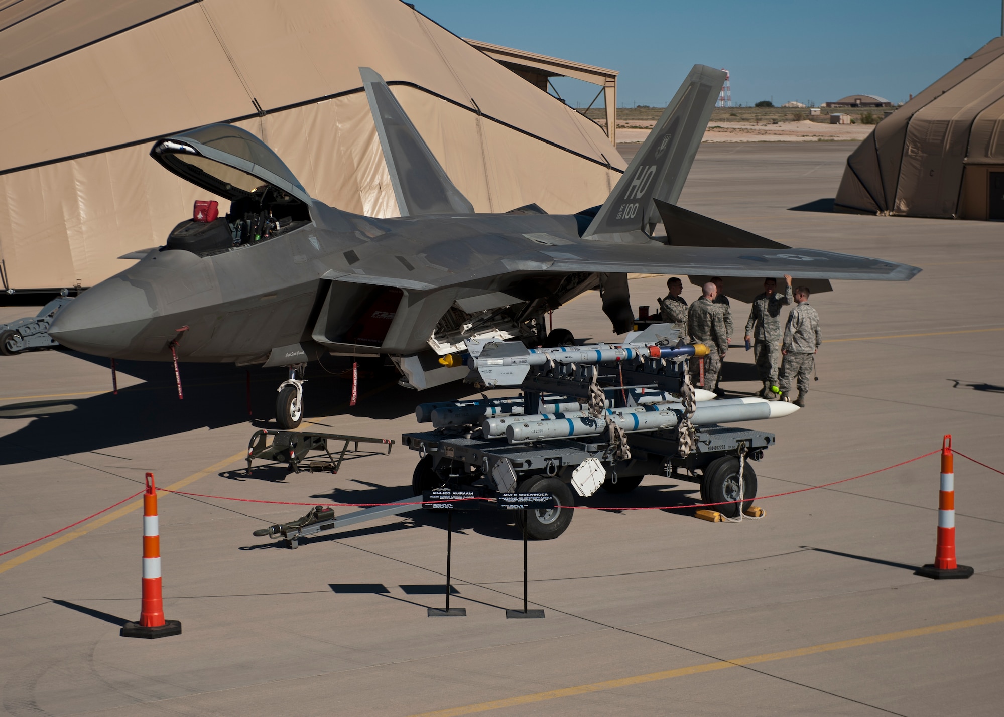 Airmen from the 49th Maintenance Group prepare for the quarterly load-crew competition at Holloman Air Force Base, N.M., Oct. 11. The F-22 Raptor load crew competed to have their skills evaluated alongside MQ-9 Reaper and German Air Force Tornado load crews. For the competition, points were awarded for weapons loading, tool kit inspection and uniform inspection. (U.S. Air Force photo by Airman 1st Class Aaron Montoya/Released)