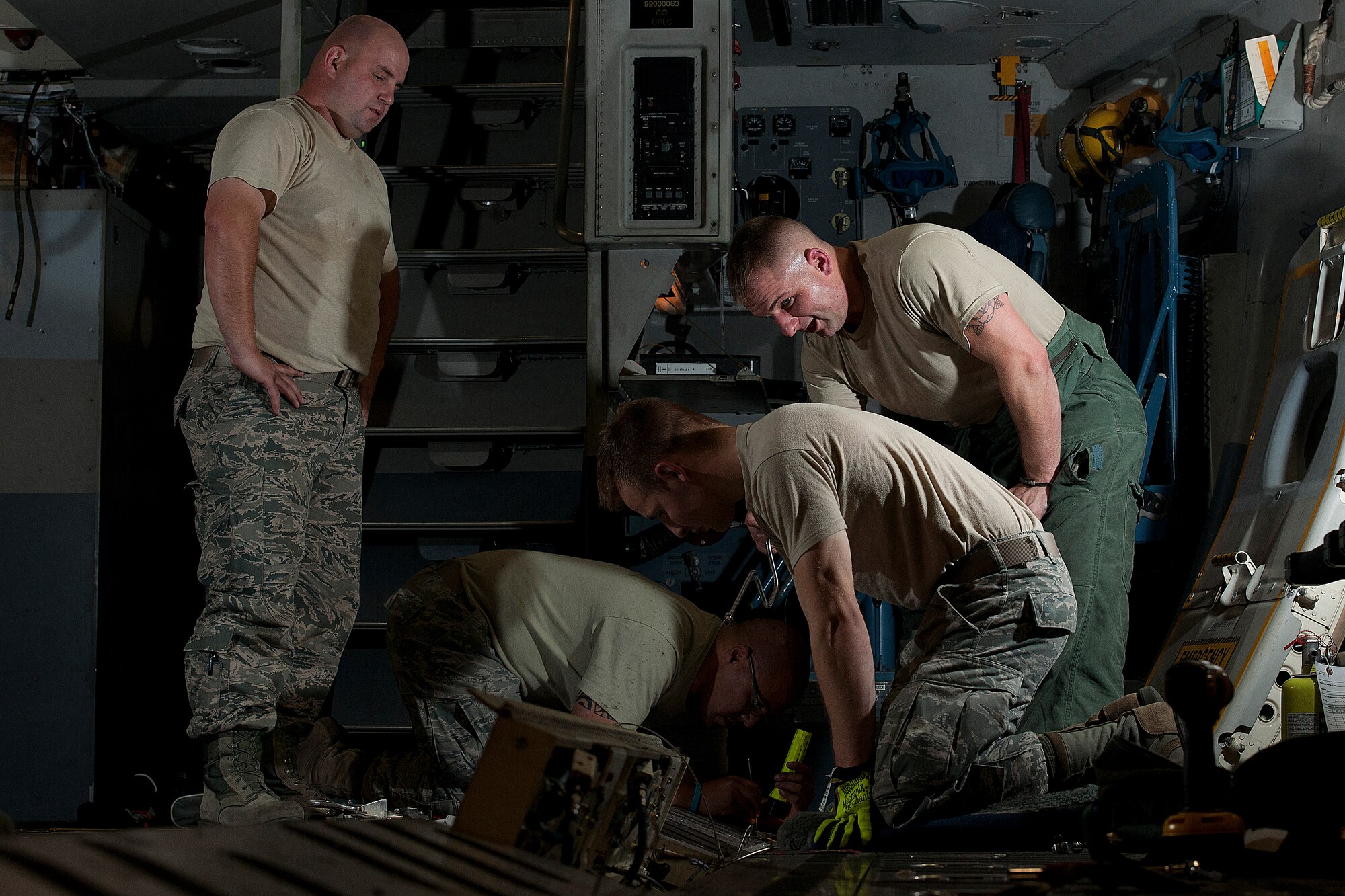 III ALTUS AIR FORCE BASE, Okla. – Members of the 97th Air Mobility Wing Maintenance A-Team inspect the airdrop railings of a C-17 Globemaster III cargo aircraft during a 720-day home station refurbishing Oct. 10, 2013. Routine maintenance of the railings include cleaning and checking for locking malfunctions as well as any internal structural damages or stressors. The airdrop system is used to facilitate loading and unloading which accounts for a vital part of Altus AFB’s mission. (U.S. Air Force photo by Senior Airman Jesse Lopez/Released)