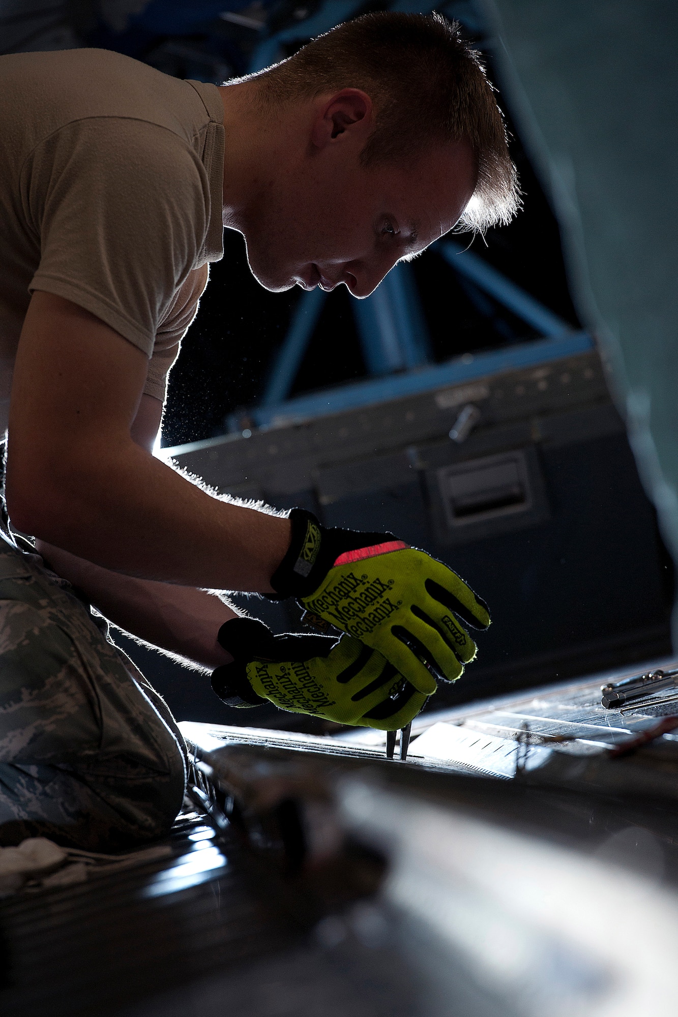 ALTUS AIR FORCE BASE, Okla. – Senior Airman Tyler Shelly, 97th Air Mobility Wing Maintenance crew chief, inspects the airdrop railings of a C-17 Globemaster III cargo aircraft during a 720-day home station refurbishing Oct. 10, 2013. With improved capabilities of potential adversaries, the airdrop system must remain serviceable to meet air mobility requirements, particularly in support of large or heavy sized cargo used to accomplish the mission Altus AFB provides. (U.S. Air Force photo by Senior Airman Jesse Lopez/Released)