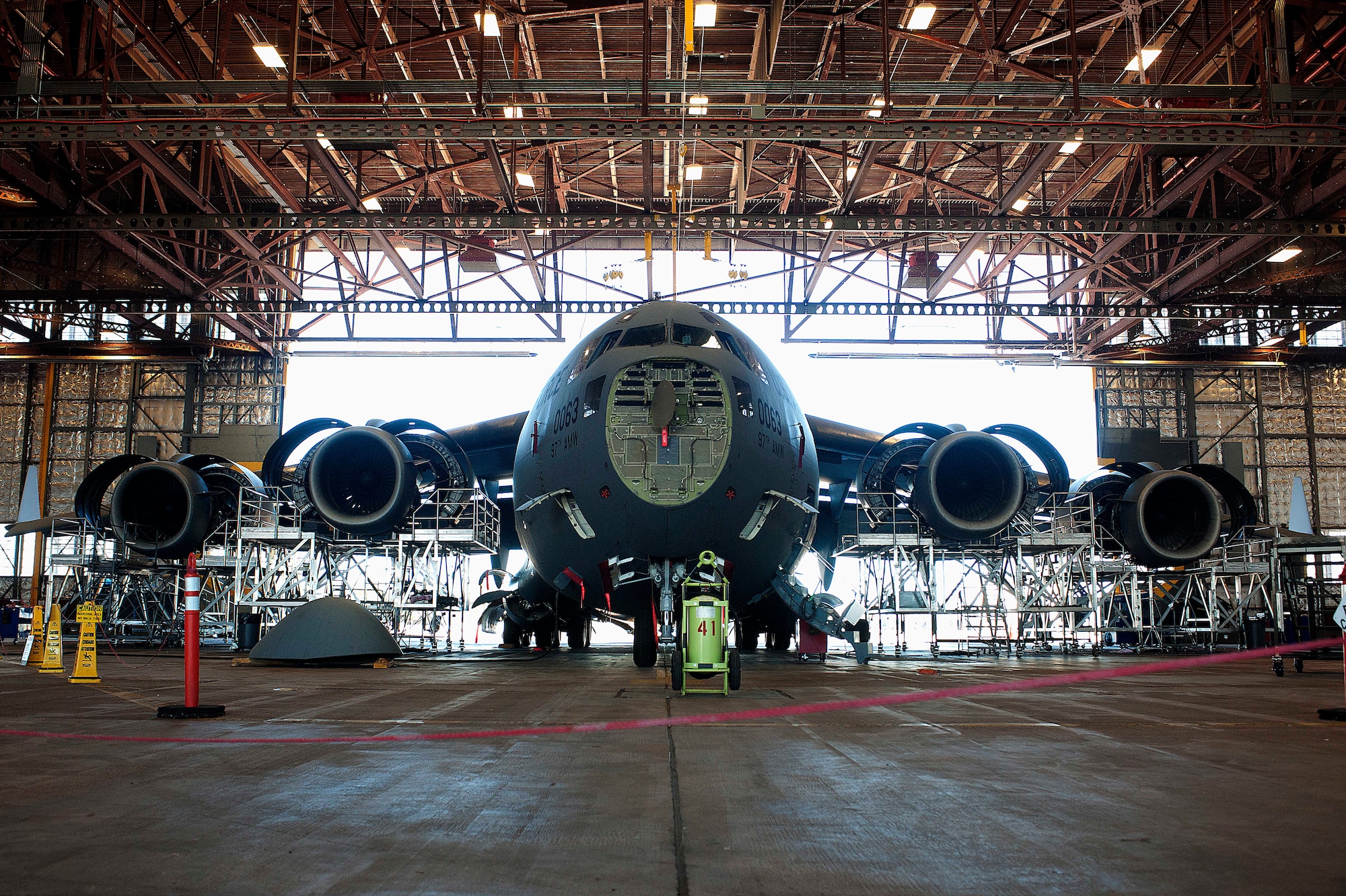 ALTUS AIR FORCE BASE, Okla. – A C-17 Globemaster III cargo aircraft sits dismantled in a hangar during a 720-day home station refurbishing Oct. 10, 2013. The 97th Air Mobility Wing Maintenance Division A-Team periodically performs this inspection to certify its operational maintenance and serviceability, garnering a mission proficient aircraft. (U.S. Air Force photo by Senior Airman Jesse Lopez/Released)