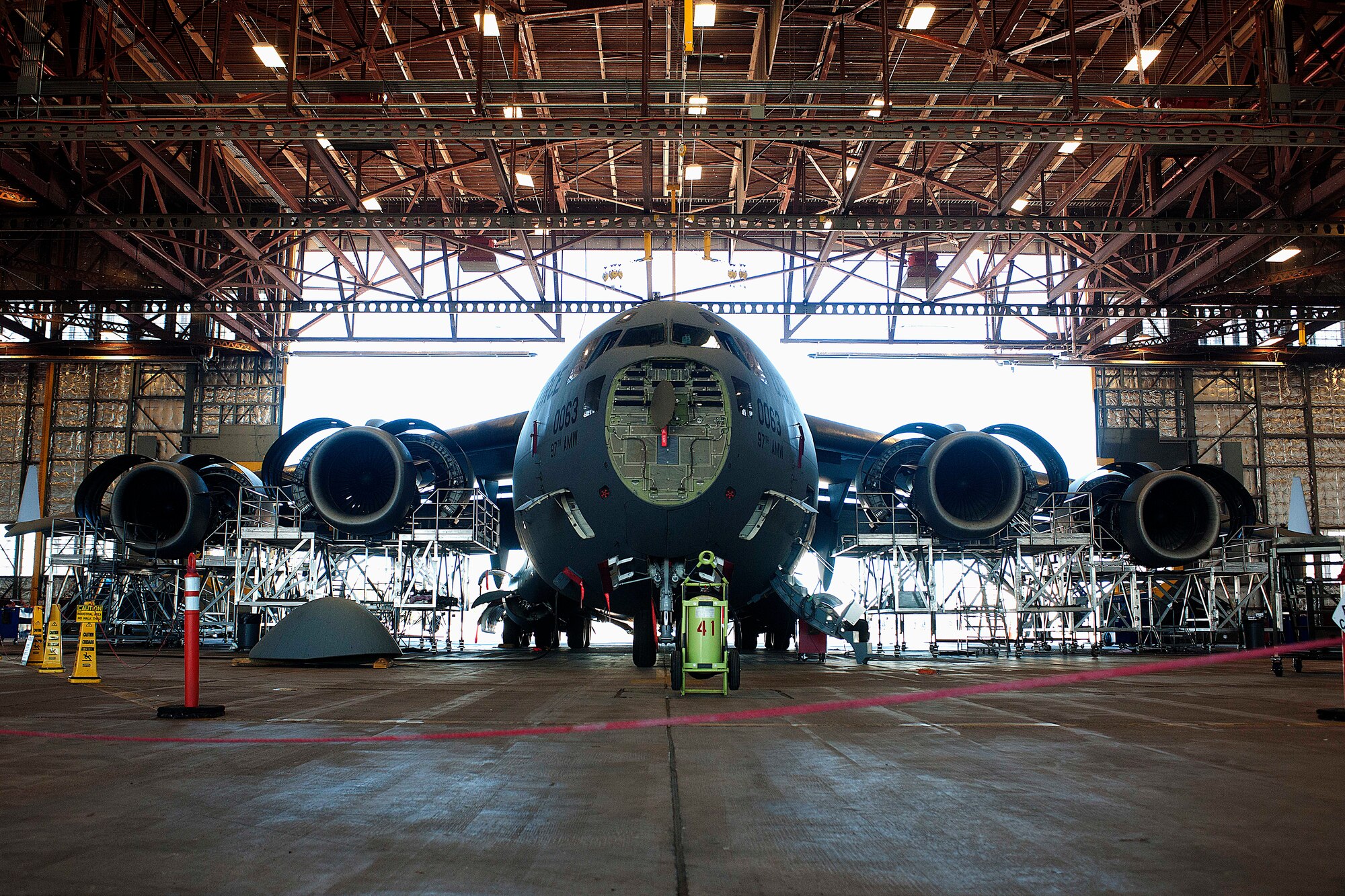 ALTUS AIR FORCE BASE, Okla. – A C-17 Globemaster III cargo aircraft sits dismantled in a hangar during a 720-day home station refurbishing Oct. 10, 2013. The 97th Air Mobility Wing Maintenance Division A-Team periodically performs this inspection to certify its operational maintenance and serviceability, garnering a mission proficient aircraft. (U.S. Air Force photo by Senior Airman Jesse Lopez/Released)