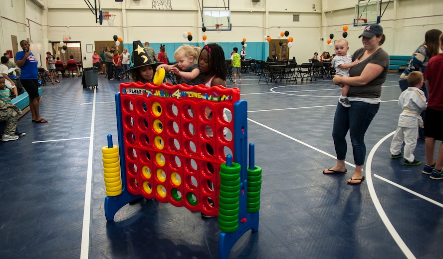Children of deployed Airmen play together during a deployed families’ ice cream social at Moody Air Force Base Ga., Oct. 15, 2013. Kristen Ramer, daughter of U.S. Air Force Col. Steven Ramer, 23d Wing vice commander, and a member of the Keystone Club, spearheaded the initiative. (U.S. Air Force photo by Airman 1st Class Sandra Marrero/Released)
