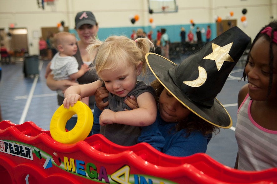 Camdyn Ruffin, daughter of U.S. Air Force Tech. Sgt. Corey Ruffin, plays a game at a Deployed Families’ Ice Cream social at Moody Air Force Base, Ga., Oct. 15, 2013. The event was organized by Moody’s Keystone Club, a teen-run leadership and service group. (U.S. Air Force photo by Airman 1st Class Sandra Marrero/Released)
