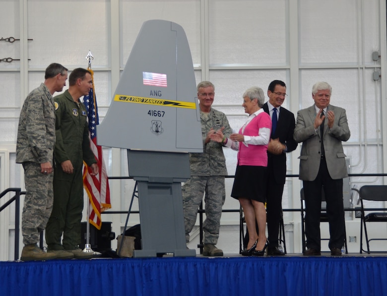 Brig. Gen. Jon Mott, Col. Frank Detorie, Maj. Gen. Thad Martin, Connecticut lieutenant governor Nancy Wyman, Connecticut governor Dannel Malloy and Connecticut Congressman John Larson celebrate the unveiling of a C-130H rear stabilizer mock up emblazoned with the Flying Yankees thunderbolt tail flash during a formal roll-out ceremony celebrating the arrival of the unit's newly-assigned airframe at Bradley Air National Guard Base, East Granby, Conn., Oct. 5, 2013. The first of eight C-130H aircraft expected to be assigned to the Connecticut Air National Guard touched down at Bradley September 24.  (U.S. Air National Guard photo courtesy of 103rd Airlift Wing Public Affairs)