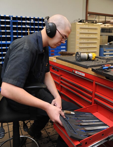 Airman 1st Class Daniel Ward, 2nd Logistics Readiness Squadron vehicle mechanic, places various files into a toolbox on Barksdale Air Force Base, La., Oct. 17, 2013. Ward used a router to cut foam to fit each type of file. (U.S. Air Force photo/Senior Airman Joseph A. Pagán Jr.)