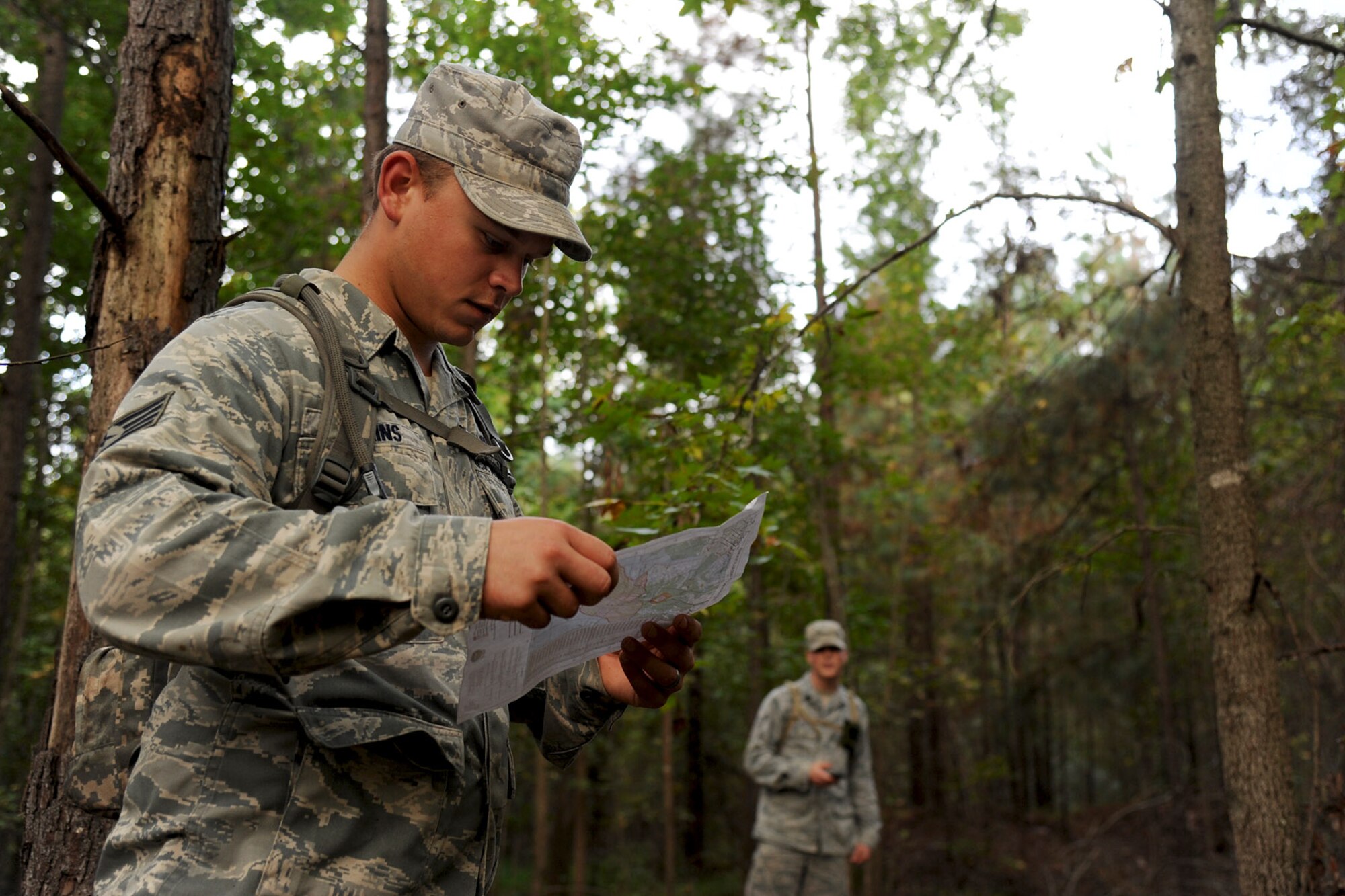 U.S. Air Force Staff Sgt. Tyler Simkins, 633rd Civil Engineer Squadron Prime Base Emergency Engineer Force (BEEF) noncommissioned officer, maps out his group’s next marker during land navigation training at Fort Eustis, Va., Oct. 16, 2013. About 40 Prime Beef Airmen participated in the training. (U.S. Air Force photo by Airman 1st Class Austin Harvill/Released)