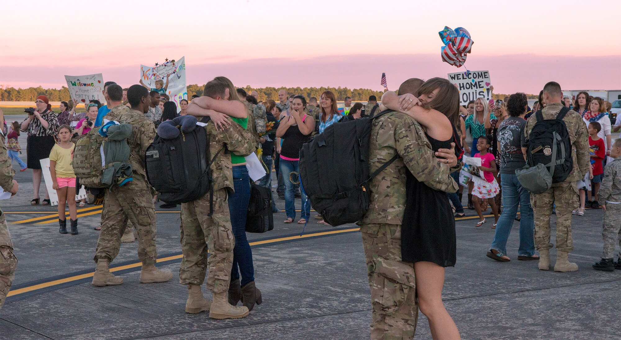 Friends, family and loved ones welcome U.S. Air Force Airmen home at Moody Air Force Base, Ga., Oct. 9, 2013. The Airmen returned from a six-month deployment to Southwest Asia. (U.S. Air Force photo by Airman 1st Class Ryan Callaghan/Released)
