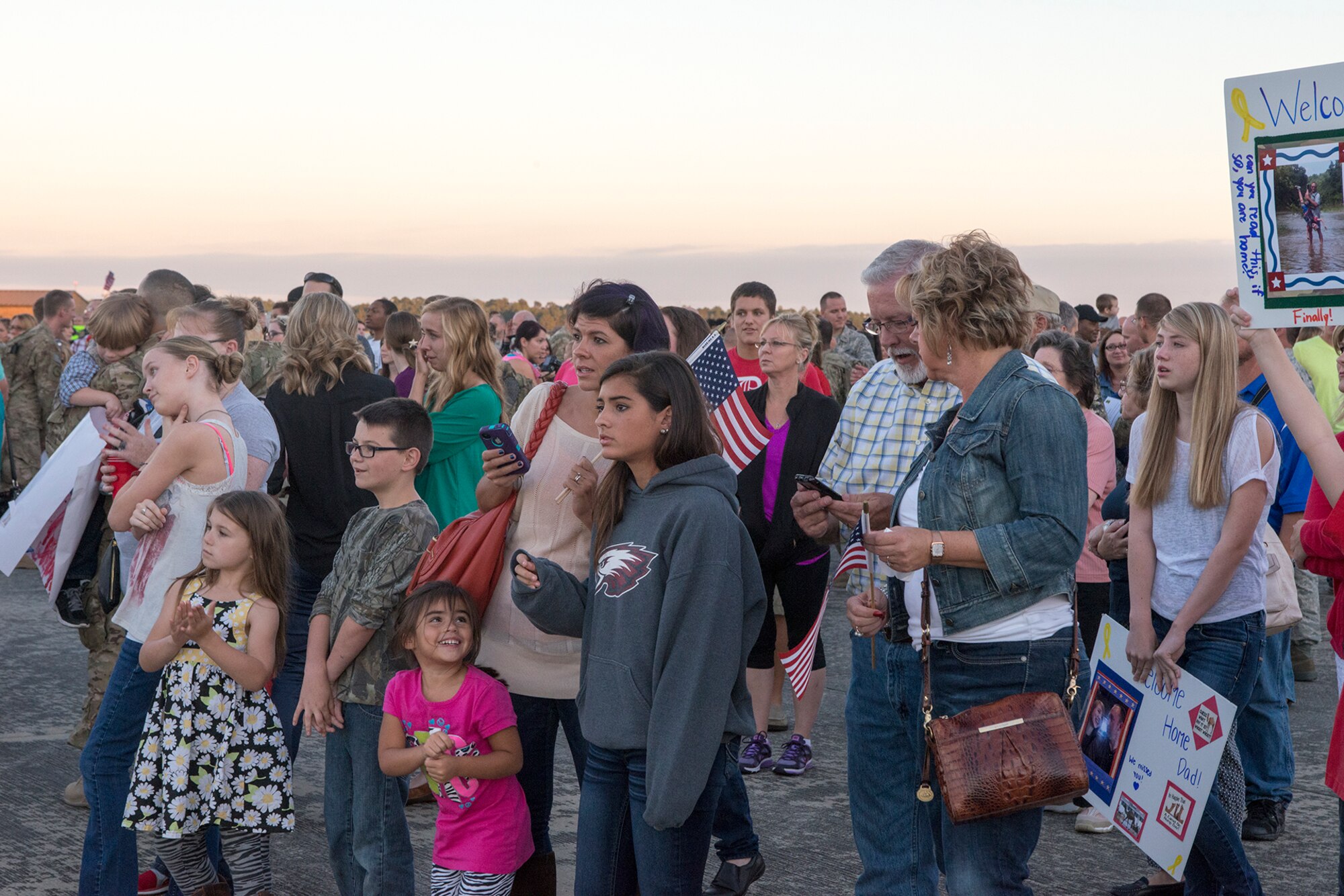 Families, friends and loved ones search the crowd for their returning Airmen at Moody Air Force Base, Ga., Oct. 9, 2013. More than 300 Airmen returned to an awaiting crowd after a six-month deployment to Southwest Asia. (U.S. Air Force photo by Airman 1st Class Ryan Callaghan/Released)
