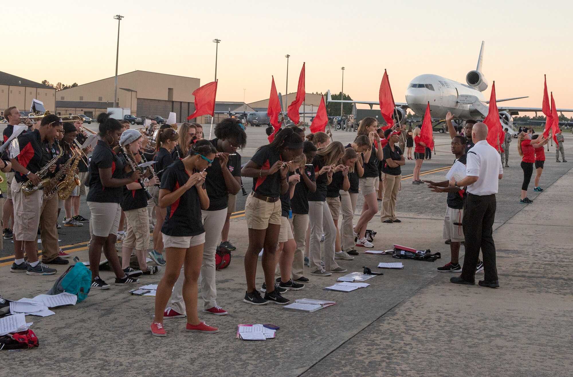 Members of the Valdosta State University marching band and color guard perform while families reunite with Airmen returning from deployment at Moody Air Force Base, Ga., Oct. 9, 2013. Many VSU students were in attendance as friends, families and loved ones return from a six-month deployment to Southwest Asia. (U.S. Air Force photo by Airman 1st Class Ryan Callaghan/Released)
