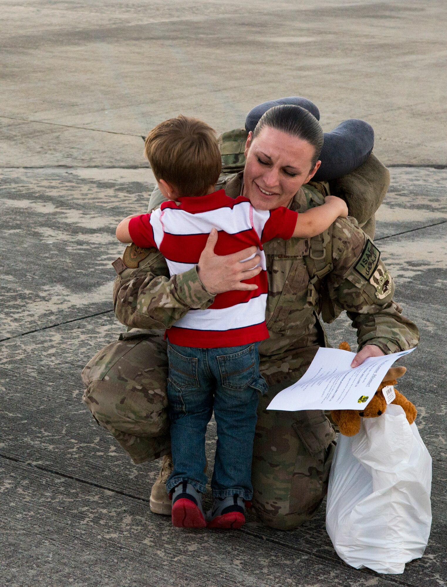 U.S. Air Force Staff Sgt. Amanda Griggs, 23d Component Maintenance Squadron engine mechanic, hugs her son at Moody Air Force Base, Ga., Oct. 9, 2013. Griggs was deployed to Southwest Asia for six months. (U.S. Air Force photo by Airman 1st Class Ryan Callaghan/Released)
