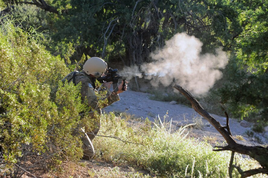 Capt. Justin Schultz, 56th Civil Engineer Squadron Explosive Ordnance Disposal commander, returns simulated fire. The exercise simulated past real-world events. (U.S. Air Force photo/Airman 1st Class Pedro Mota)