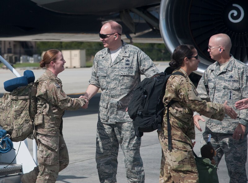 U.S. Air Force Col. Jeffrey Decker, 23d Maintenance Group commander, greets returning Airmen at Moody Air Force Base, Ga., Oct. 13, 2013. The redeployed Airmen returned from a six-month deployment to Camp Bastion, Afghanistan. (U.S. Air Force photo by Airman Dillian Bamman/Released)