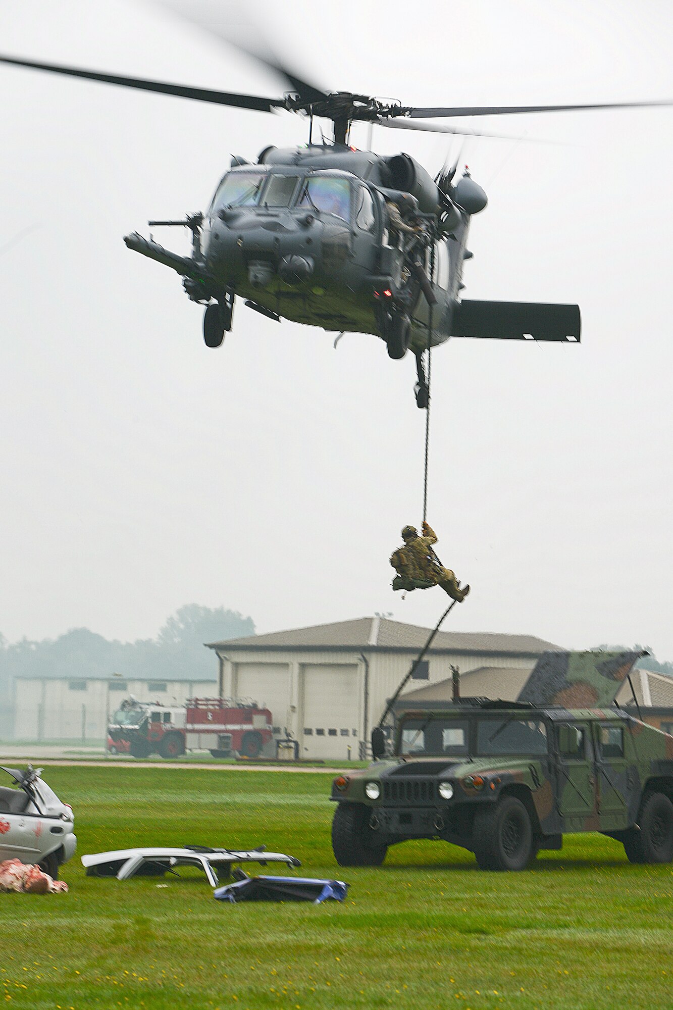 A pararescue specialist assigned to the 56th Rescue Squadron rappels from an HH-60G Pave Hawk during a combat rescue training exercise at Royal Air Force Lakenheath, England, Oct. 17, 2013. The scenario was a rescue mission in which the pararescue team recovered an injured person involved in a vehicle borne improvised explosive device blast. (U.S. Air Force photo by Airman 1st Class Trevor T. McBride/Released)   