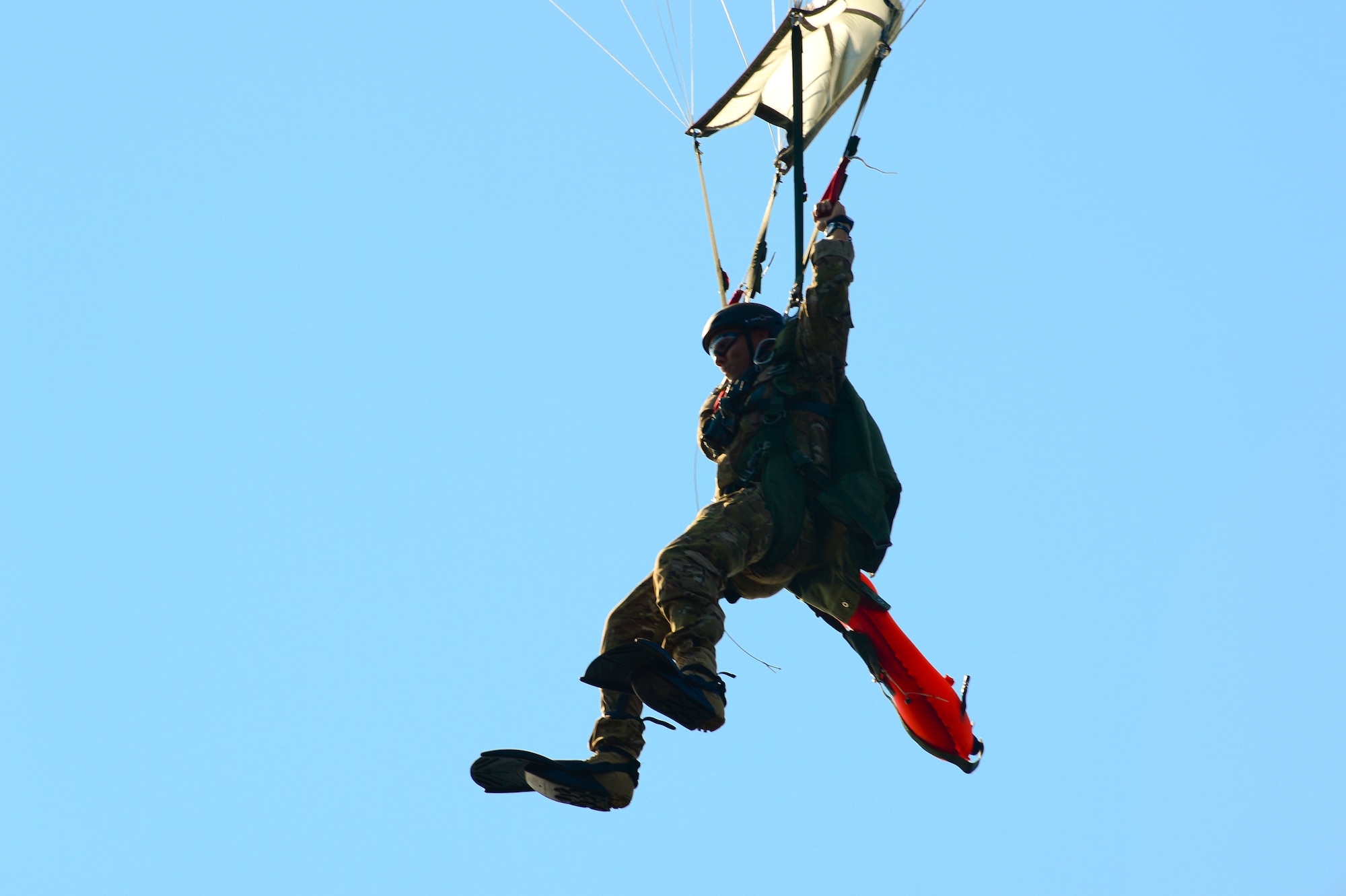 Staff Sgt. Johnnie Yellock Jr., a 23rd Special Tactics Squadron combat controller, parachutes down after completing his final free fall jump before being medically retired Oct. 16, 2013, Hurlburt Field, Fla. Yellock endured 28 surgeries and two years of intense physical therapy to be able to walk again after his vehicle was struck by an improvised explosive device during a 2011 deployment to Afghanistan. (U.S. Air Force photo by Staff Sgt. John Bainter)