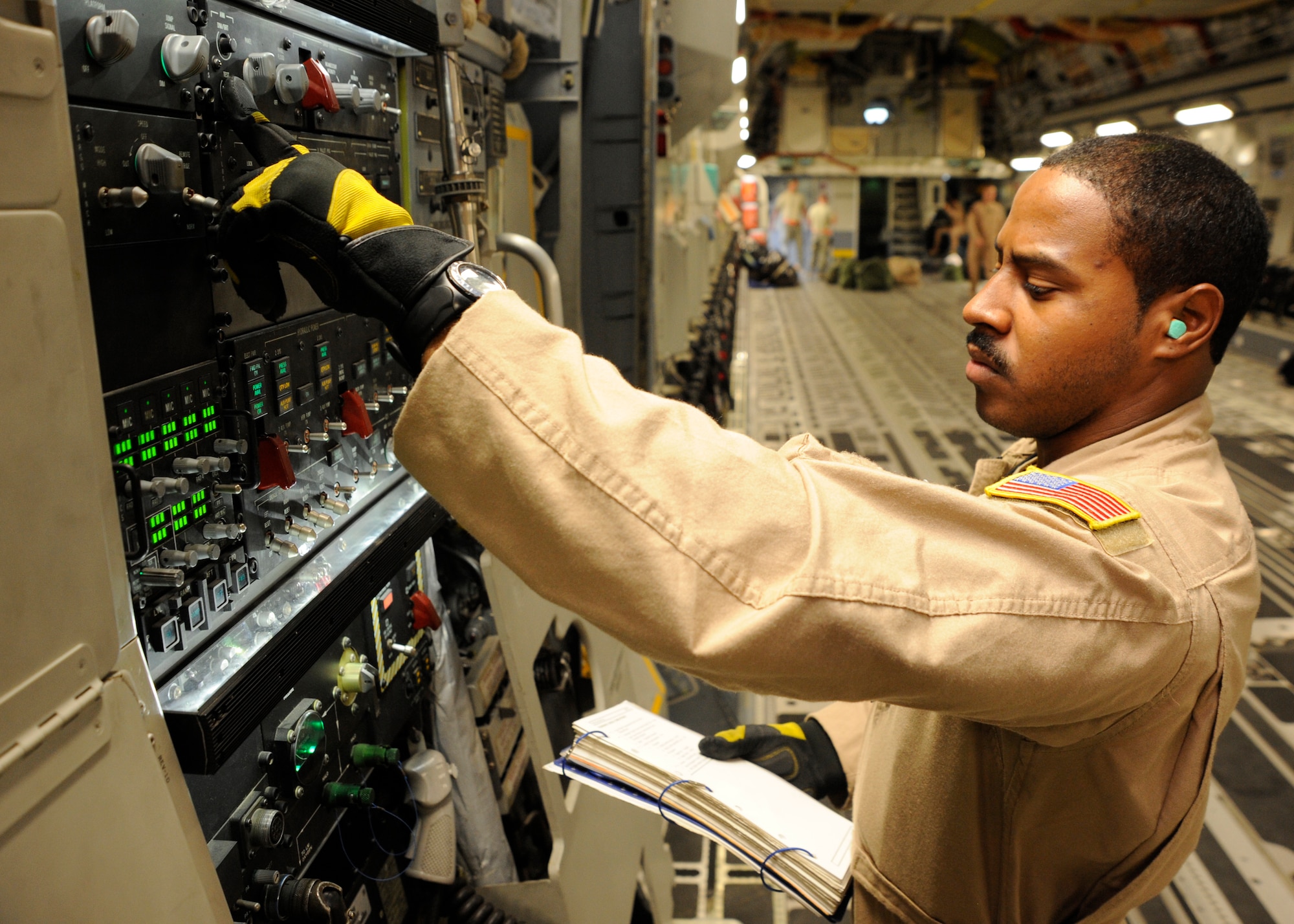 Staff Sgt. Frederick Jordan performs a preflight check on a C-17 Globemaster III prior to a mission at the 379th Air Expeditionary Wing in Southwest Asia, Oct. 16, 2013. In this rotation, the 816th EAS has flown more than 375 sorties, transported 13.2 million pounds of cargo and nearly 2,400 passengers. Additionally, they have airdropped more than 71,000 pounds of cargo to forward bases throughout the AOR. Jordan is an 816th Expeditionary Airlift Squadron C-17 loadmaster deployed from Joint Base Charleston, S.C., and a Panama City, Panama, native. (U.S. Air Force photo/Senior Airman Bahja J. Jones) 