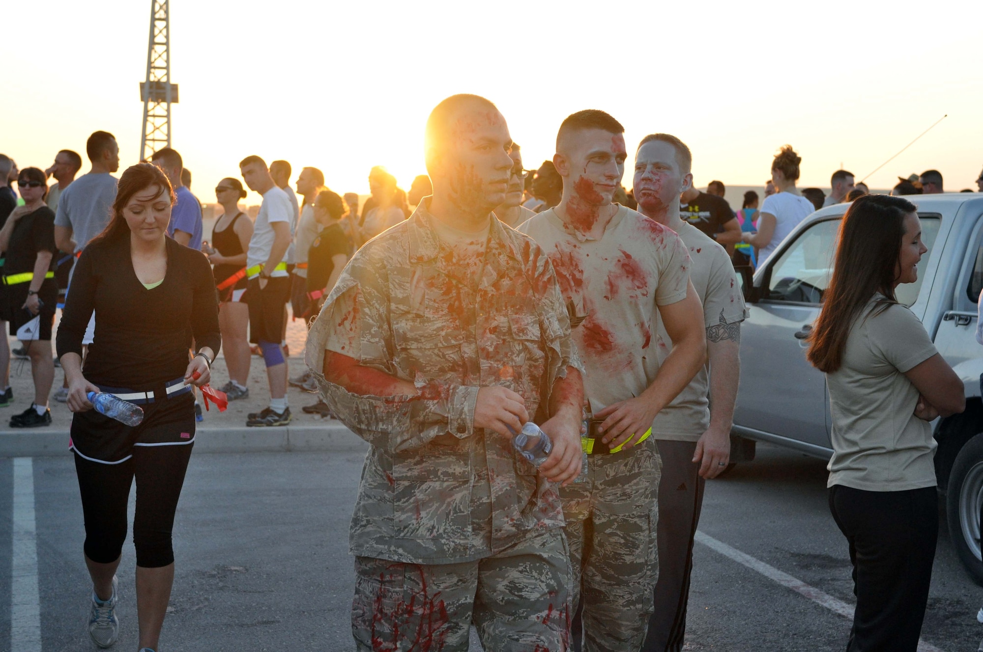 Service members prepare to participate in a zombie run at the 379th Air Expeditionary Wing in Southwest Asia, Oct. 12, 2013. The run was hosted by the Rising Six private organization to boost the morale of individuals on the base. (U.S. Air Force photo/1st Lt. Susan Harrington)