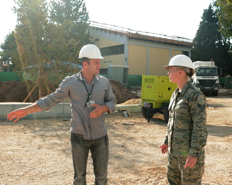 Senior Airman Jacqueline Bongard, 39th Contracting Squadron contract administrator, performs a site survey with her Turkish counterpart Sept. 30, 2013, at Incirlik Air Base, Turkey. The 39th CONS plays a part in base projects ranging from major construction to smaller unit requests for equipment such as vehicles. (U.S. Air Force photo by Staff Sgt. Eric Summers Jr./Released)