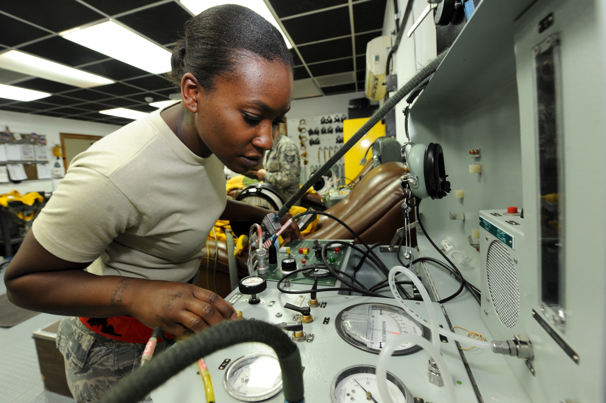 U.S. Staff Sgt. Jasmine Chambers, 99th Expeditionary Reconnaissance Squadron physiological support detachment technician, checks a pressure suit for air leaks during a post-flight inspection at an undisclosed location in Southwest Asia, Oct. 7, 2013. The equipment Chambers uses to inspect the suit is so specialized to the career field, PSD Airmen are the only ones authorized to maintain and calibrate it. Chambers is native to Charlotte, N.C., and is deployed from Beale Air Force Base, Calif. (U.S. Air Force photo by Staff Sgt. Joshua J. Garcia)