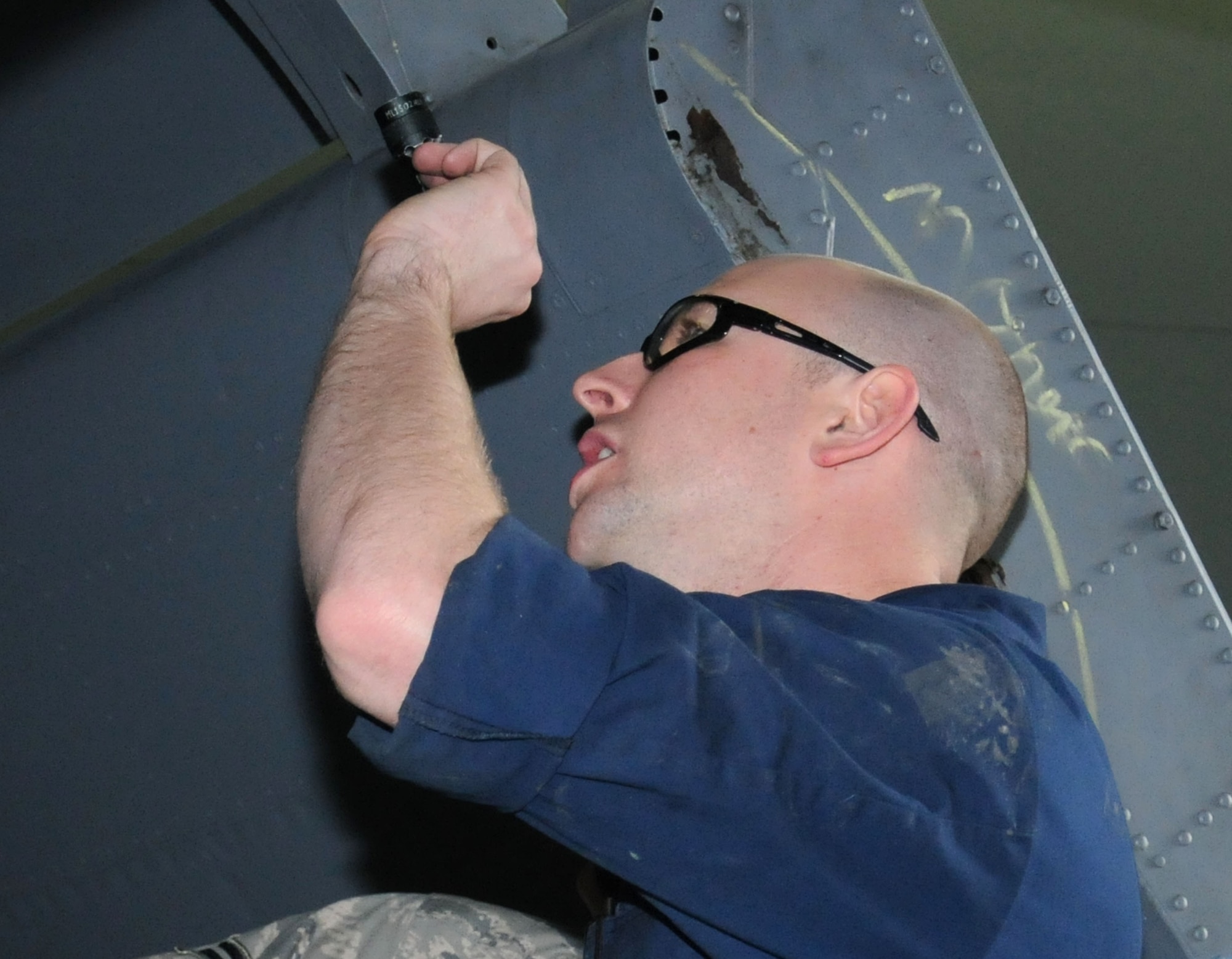 U.S. Air Force Staff Sgt. Jason Fleming, 100th Maintenance Squadron aircraft structural maintenance craftsman from Fort Oglethorpe, Ga., uses a flashlight to inspect a crack on a KC-135 Stratotanker wing panel Oct. 8, 2013, on RAF Mildenhall, England. The 100th MXS inspection shop performs preventative maintenance on KC-135 engines to ensure they are mission ready. The shop works with other squadrons including the 100th Aircraft Maintenance Squadron, 95th Reconnaissance Squadron and 352nd  Special Operations Group. (U.S. Air Force photo by Gina Randall/Released) 