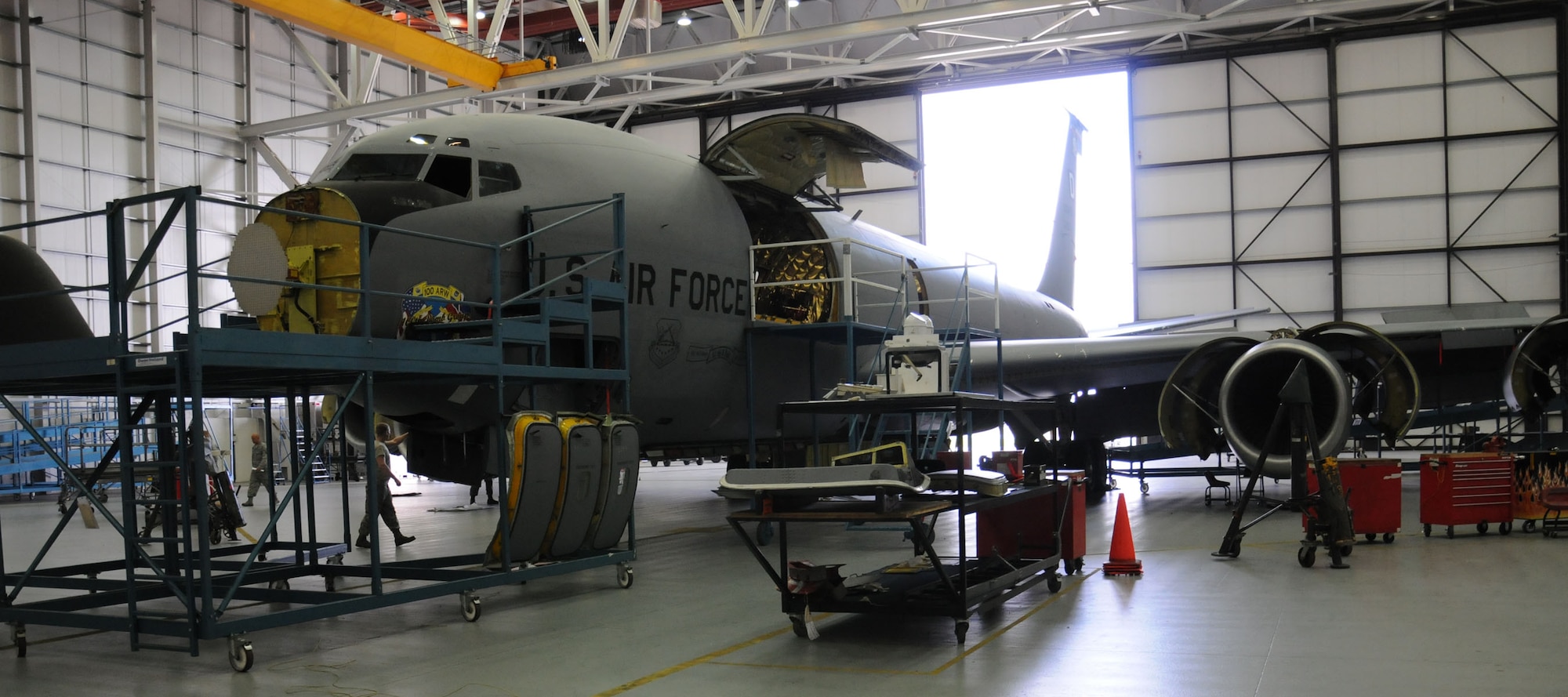 Airmen from the 100th Maintenance Squadron work on a KC-135 Stratotanker Oct. 8, 2013, in Hangar 814 on RAF Mildenhall, England. The 100th MXS isochronal shop’s mission is to accomplish hourly post flight, periodic and 900-hour inspections on 15 KC-135R aircraft assigned to RAF Mildenhall. The shop’s service members wash and inspect the fleet for corrosion and carry out repairs found during the inspections. (U.S. Air Force photo by Gina Randall/Released)