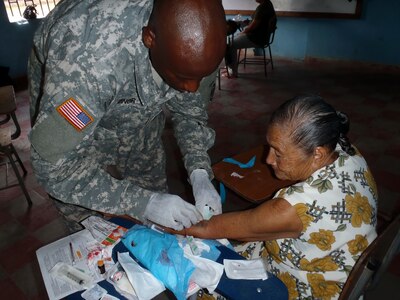 Members of Joint Task Force-Bravo's Medical Element (MEDEL) provide medical care to Honduran citizens during a Medical Readiness Training Exercise (MEDRETE) in the Department of Comayagua, Honduras, Oct. 17, 2013.  Joint Task Force-Bravo partnered with the Honduran Ministry of Health and the Honduran military to provide medical care to more than 900 people during the operation.  (Photo by U.S. Army Sgt. Courtney Kreft)