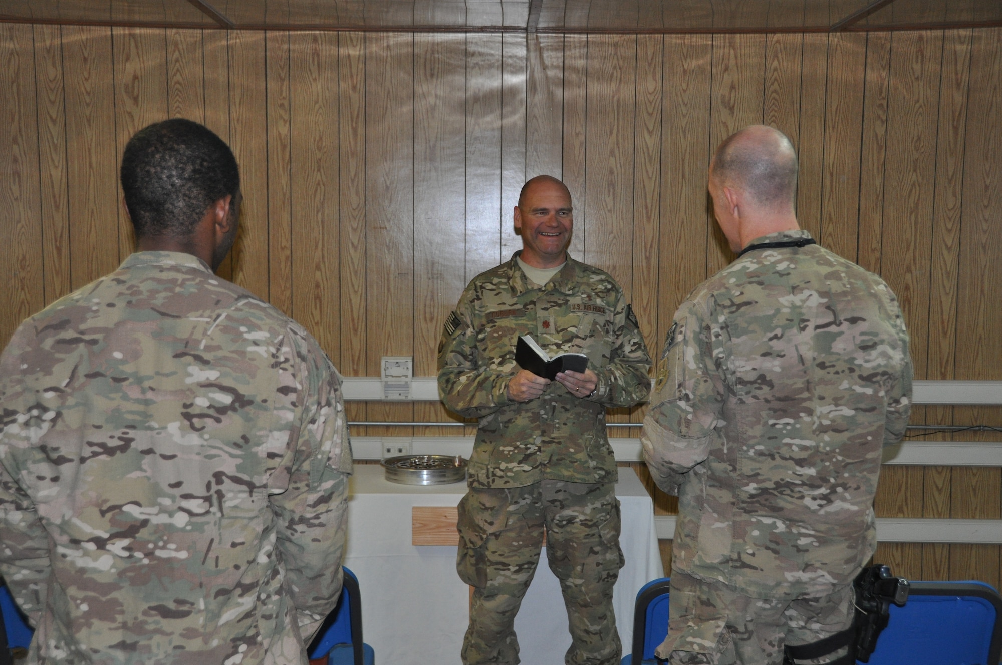 Chaplain (Maj.) Gary Coburn, 455th Air Expeditionary Wing deputy wing chaplain, who’s deployed from Buckley Air Force Base, Colo. and a native of Prattville, Ala., conducts a non-denominational Christian worship service at the Bagram Airfield flightline chapel Oct. 20, 2013. (U.S. Air Force photo/Tech. Sgt. Rob Hazelett)