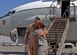 Senior Master Sgt. Timothy Lindell is met by his daughter, Staff Sgt. Kimberly Haithcoat, after his final flight aboard an RC-135 Rivet Joint at the 379th Air Expeditionary Wing in Southwest Asia, Oct. 10, 2013. Lindell and his daughter were both deployed at the same time and able to spend the last four months of his service in the Air Force together. 