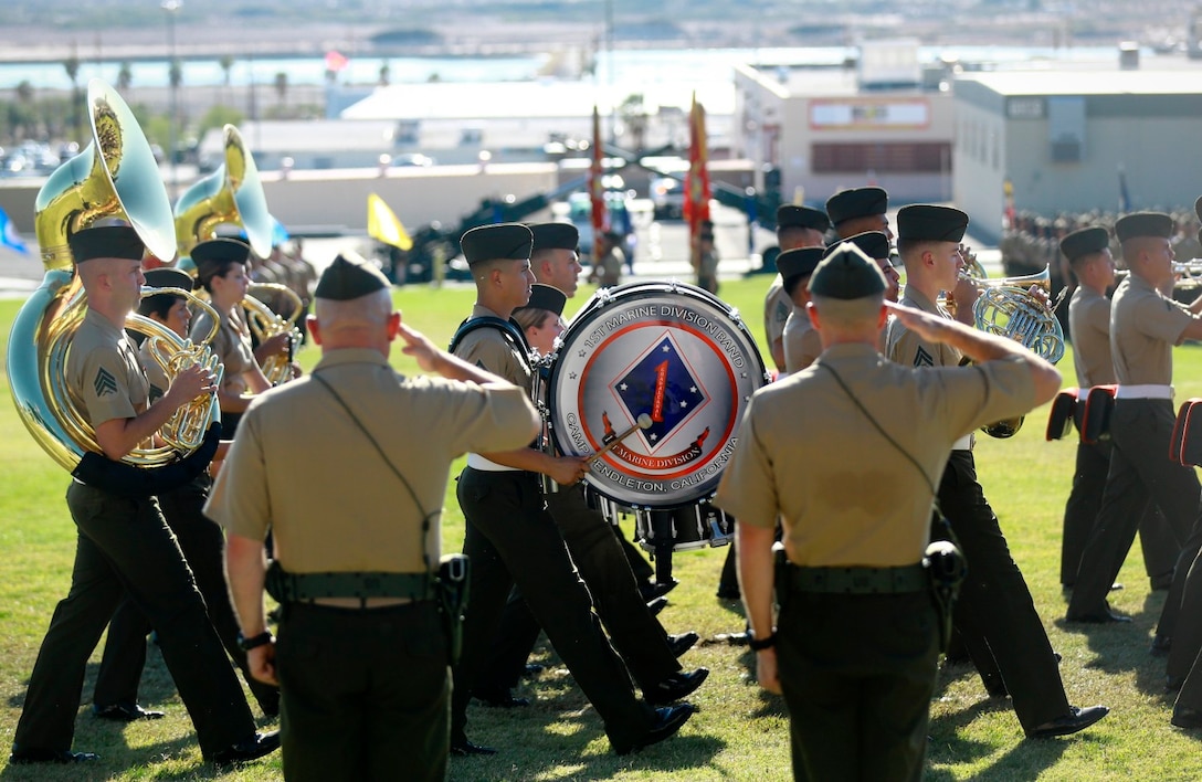 Colonel Austin E. Renforth (left) and Col. Jay M. Bargeron salute during the pass and review portion of a change of command ceremony where Renforth relinquished command of 7th Marine Regiment at the Lance Cpl. Torrey L. Gray Memorial Field here, Oct. 17, 2013.