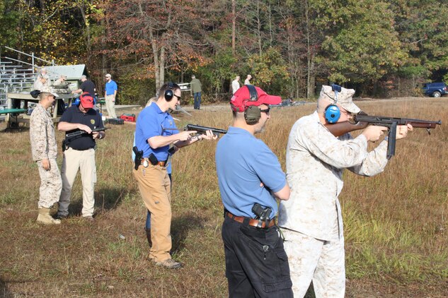 Members of the Wounded Warrior Regiment receive instruction and fire weapons during an event at Range 7 aboard Marine Corps Base Quantico on Oct. 17, 2013. The FBI provided a variety of more than two dozen weapons for the Marines to shoot.