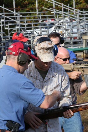 Members of the Wounded Warrior Regiment receive instruction and fire weapons during an event at Range 7 aboard Marine Corps Base Quantico on Oct. 17, 2013. The FBI provided a variety of more than two dozen weapons for the Marines to shoot.