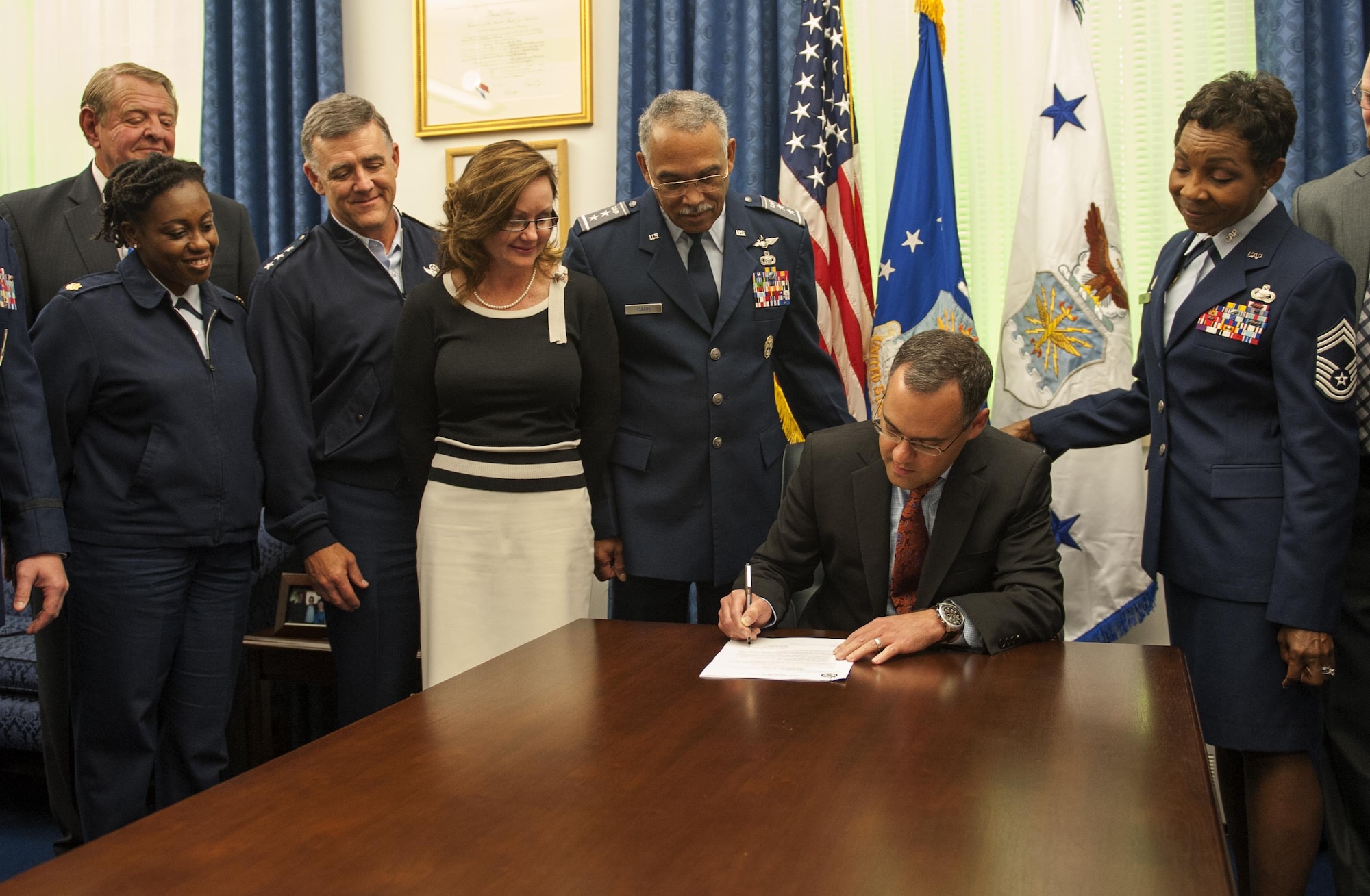 Daniel Ginsberg approves a proposal for the Civil Air Patrol to restructure their non-commissioned officer corps Oct. 18, 2013, in Washington, D.C. Now, with the newly-established NCO corps structure, NCOs will be able to progress and promote through the ranks similar to the Air Force. Ginsberg is the assistant secretary of the Air Force for manpower and Reserve affairs.