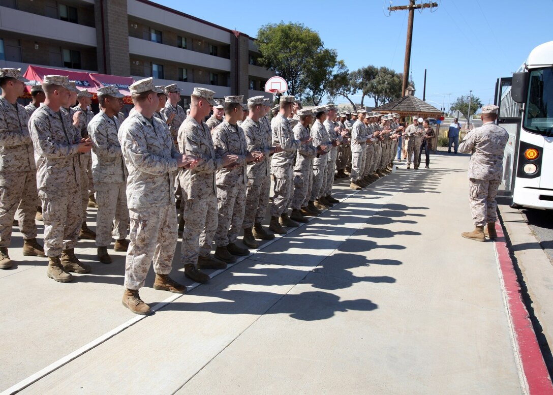 Marines with 1st Air Naval Gunfire Liaison Company applaud Marines with Supporting Arms Liaison Team 8, returning from Afghanistan during a homecoming aboard Camp Pendleton, Calif., Oct. 18. The 1st ANGLICO Marines worked directly with the Georgian Armed Forces to provide fire support assistance during combat operations in Afghanistan during their seven-month deployment.