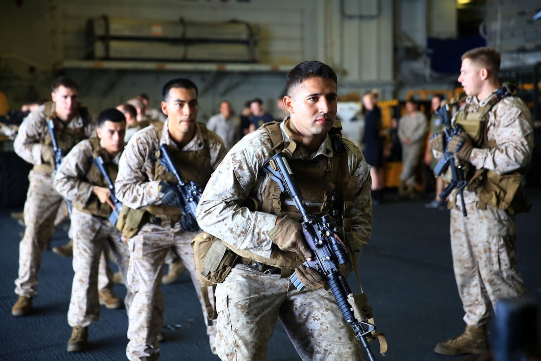 U.S. Marines with Battalion Landing Team 1/4, 13th Marine Expeditionary Unit, practice live-fire maneuvers aboard the USS Boxer (LHD 4) Oct. 16, 2013. The 13th MEU is deployed with the Boxer Amphibious Ready Group as a theater reserve and crisis response force throughout the U.S. 5th Fleet area of responsibility. (U.S. Marine Corps Photo by Sgt. Jennifer Pirante/RELEASED)