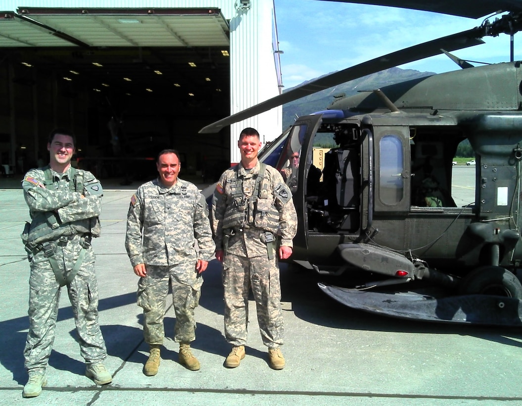 Col. Christopher Lestochi (center), commander of the U.S. Army Corps of Engineers – Alaska District, poses with Capt. Robert Weakland (left) and Maj. Eric Marcellus (right) in front of a UH-60 Blackhawk helicopter on Joint Base Elmendorf – Richardson in June 2013. Weakland and Marcellus are both civil engineers for the Alaska District and serve as aviators in the Alaska Army National Guard’s 1st Battalion, 207th Aviation Regiment.